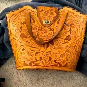 A beautiful vintage tooled leather bag
